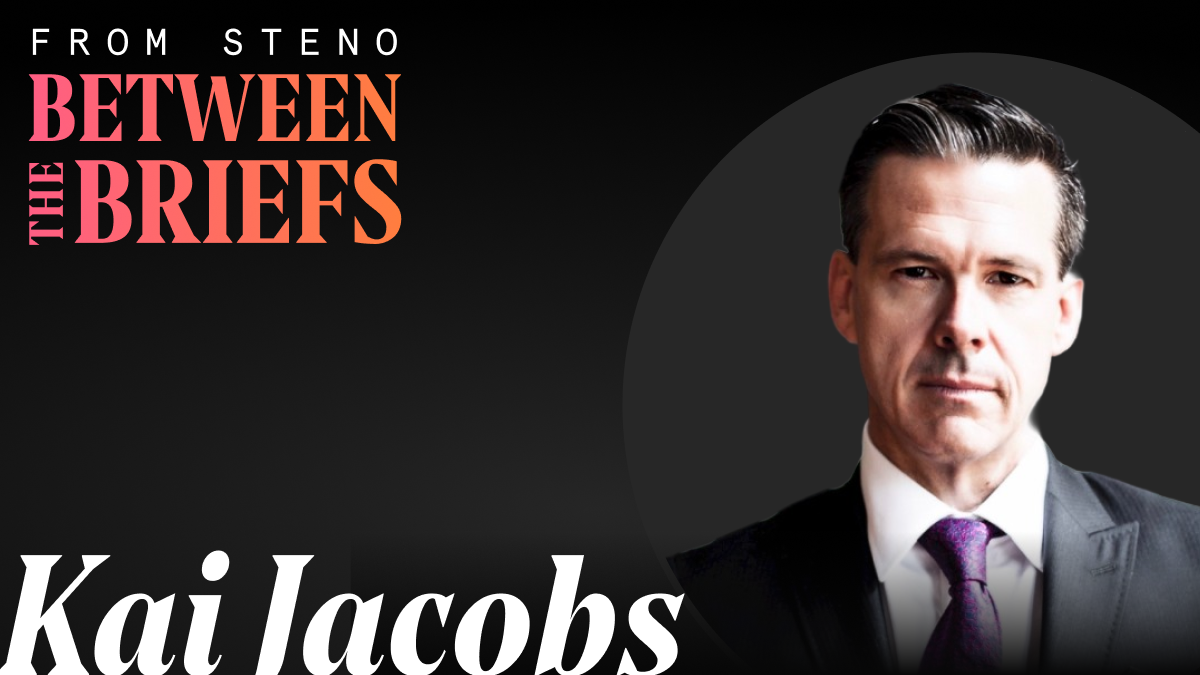 Between the Briefs title card with headshot of guest Kai Jacobs